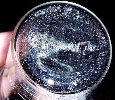 Et glas efter afbrænding af ståluld i flydende ilt