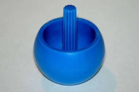 Close-up of a plastic tippe top